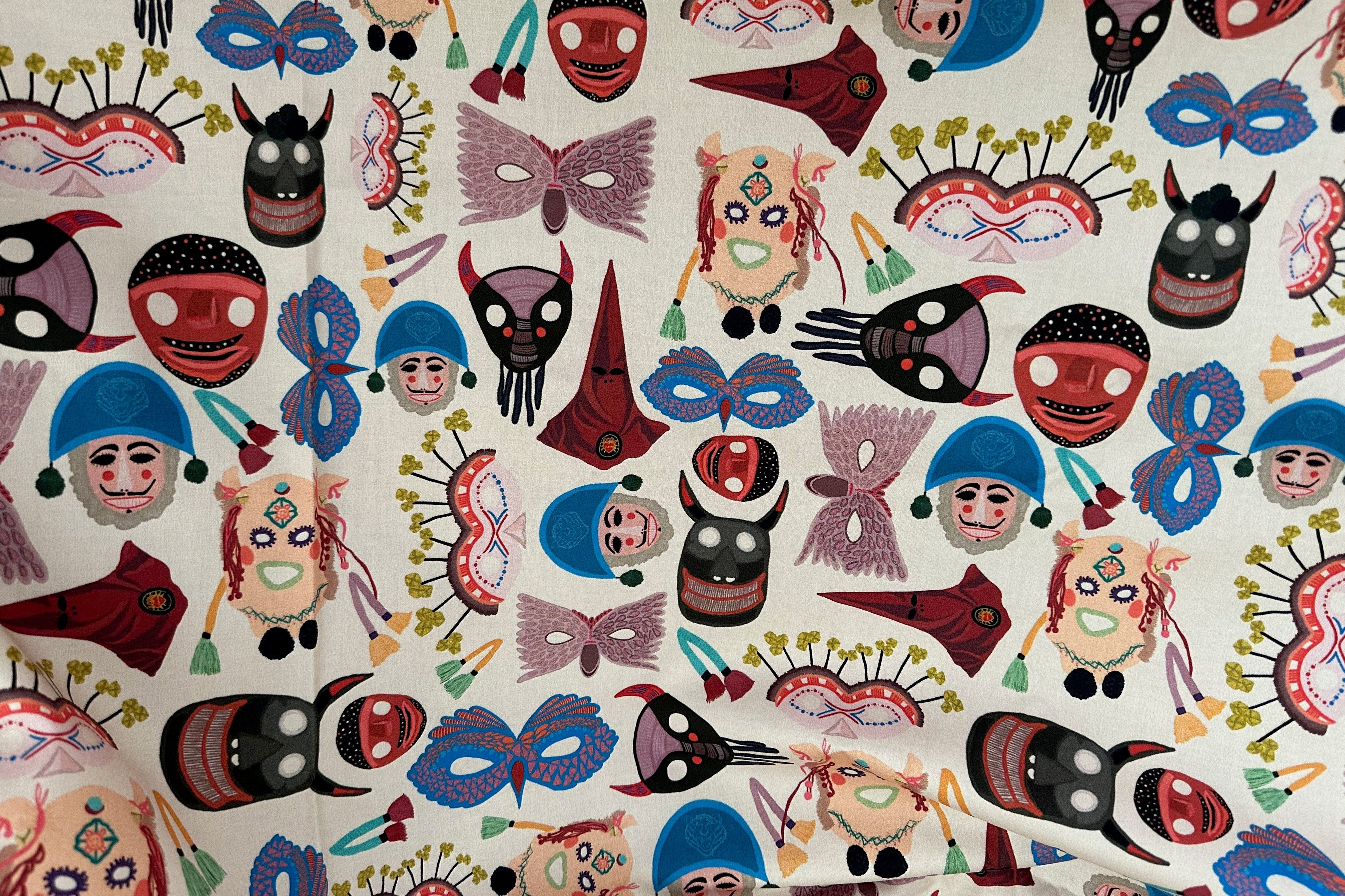 Pattern of colorful masks on a white background