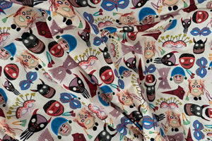 Patterned fabric with colorful masks and bows on a white background