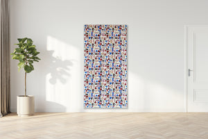 Colorful abstract painting on a white wall with a plant and door in the background